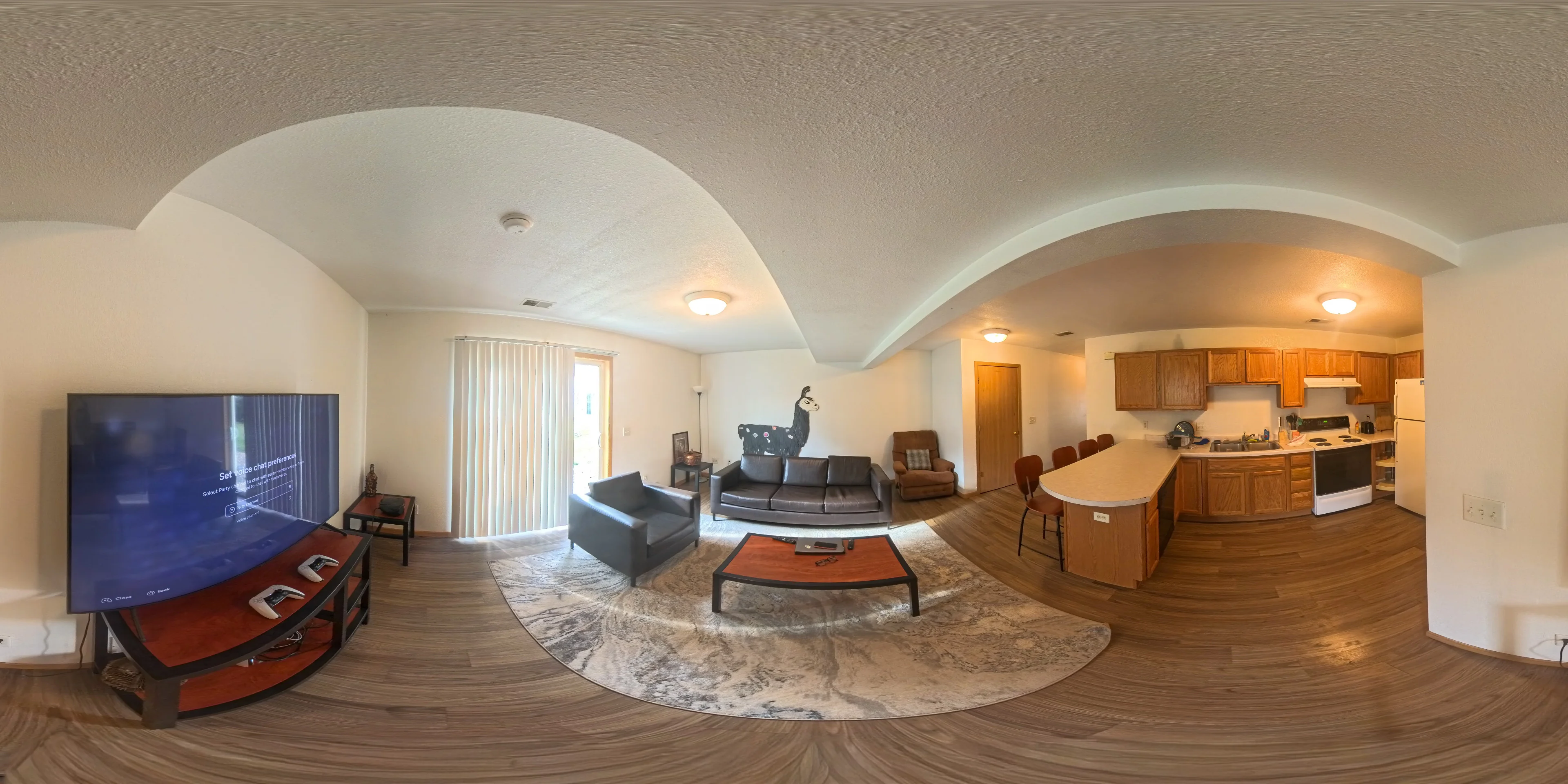 A panoramic view connecting the living area and kitchen